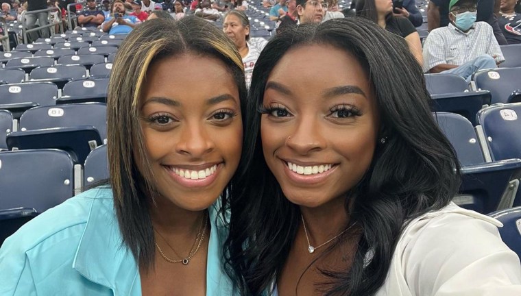 Simone Biles (right) and her younger sister, Adria.