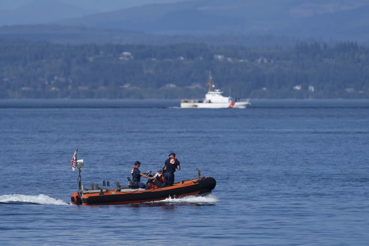 A pair of Coast Guard vessels search the area near Seattle  where a chartered floatplane carrying 10 people crashed Sunday evening. The search was called off Monday afternoon.  