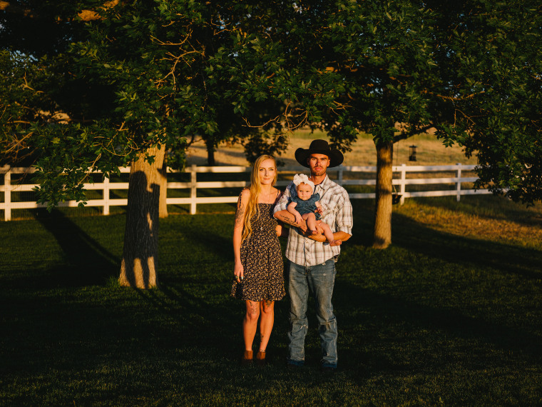 Image: Kelsie VanMeveren and Andrew Scavuzzo, at home in Parker, Colo., with their baby. They met in 2020 after VanMeveren began speaking out about her time at Trinity Teen Solutions.