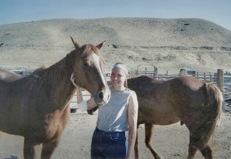 Image: Aubrie Bak-Jensen stands next to a horse at Trinity Teen Solutions. Her arm was bandaged after an accident in which she said she was thrown from a horse named Nitro.