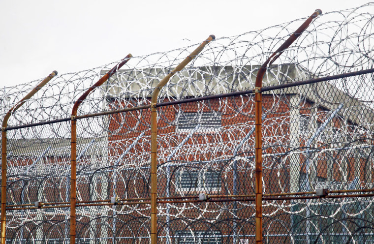 A barbed wire fence outside Rikers Island correctional facility