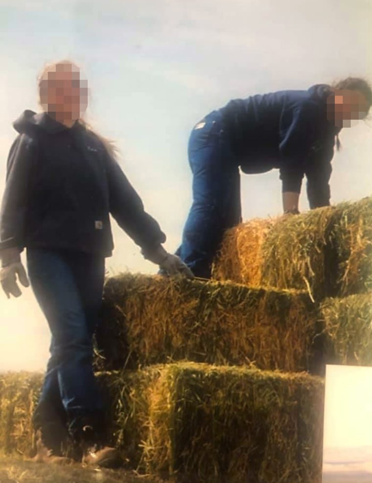 Image: Girls at Trinity Teen Solutions had to carry hay bales. Faces have been obscured by NBC News.