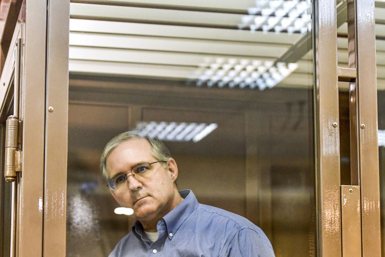 Paul Whelan, a former US Marine accused of espionage and arrested in Russia, stands inside a defendants' cage during a hearing at a court in Moscow on January 22, 2019.