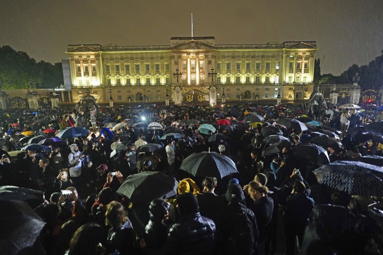 Image: People gather outside Buckingham Palace following the announcement of the death of Queen Elizabeth II on Thursday.