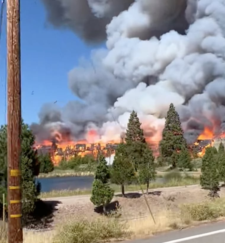 Smoke rises from the Mill Fire in Weed, Calif.