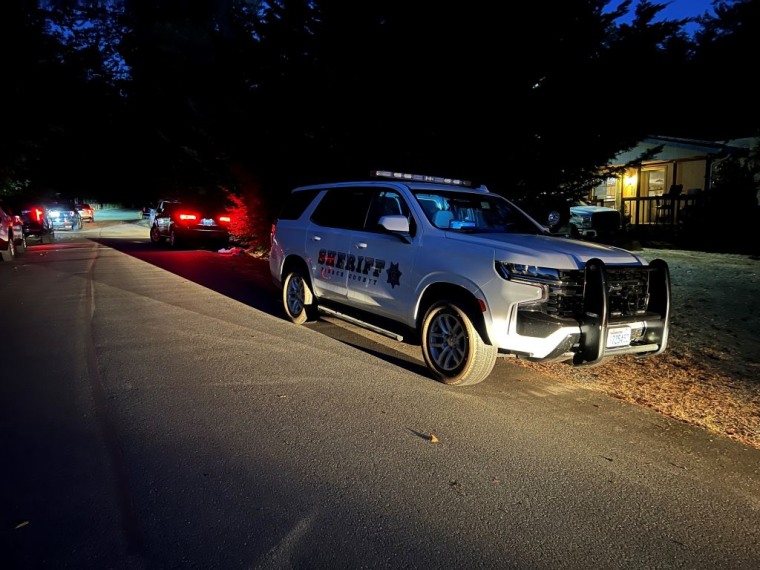 Pierce County deputies respond to a welfare check Thursday in Orting, Wash. 