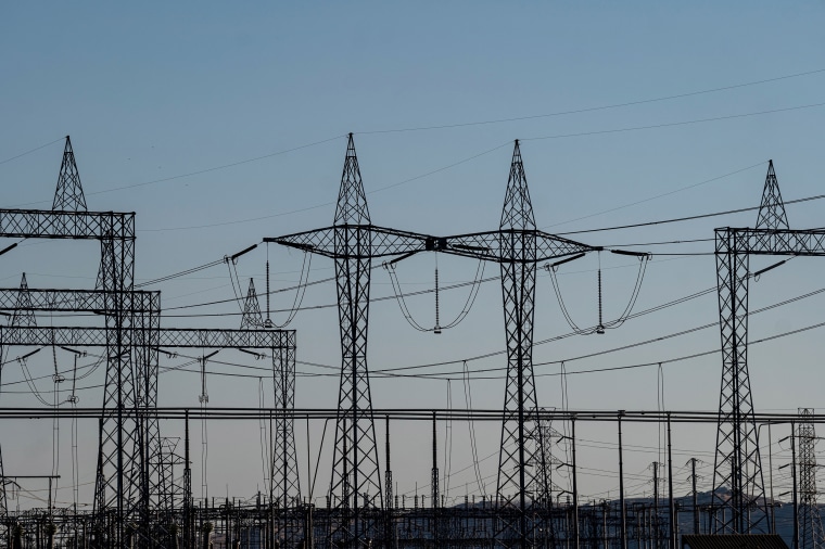 Image: Electrical transmission towers at a Pacific Gas and Electric (PG&E) electrical substation during a heatwave in Vacaville, Calif., on  Sept. 4, 2022.