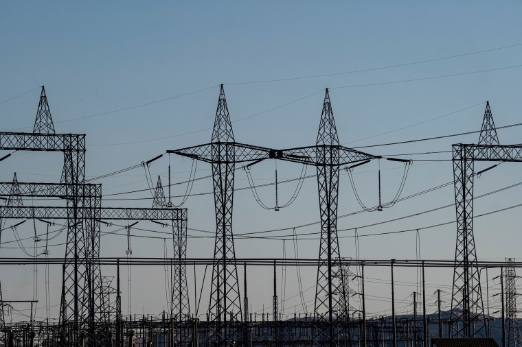 Image: Electrical transmission towers at a Pacific Gas and Electric (PG&E) electrical substation during a heatwave in Vacaville, Calif., on Sept. 4, 2022.