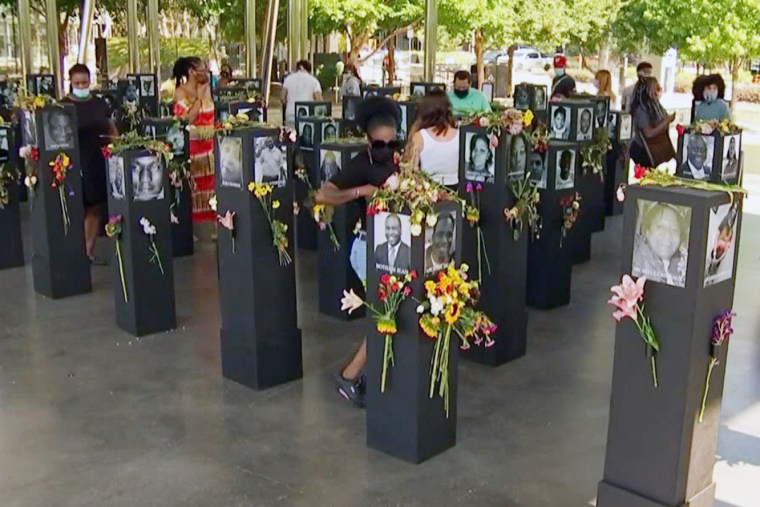 Image: Visitors at the temporary  "Say Their Names Memorial" at the Klyde Warren Park in Downtown Dallas in 2020.