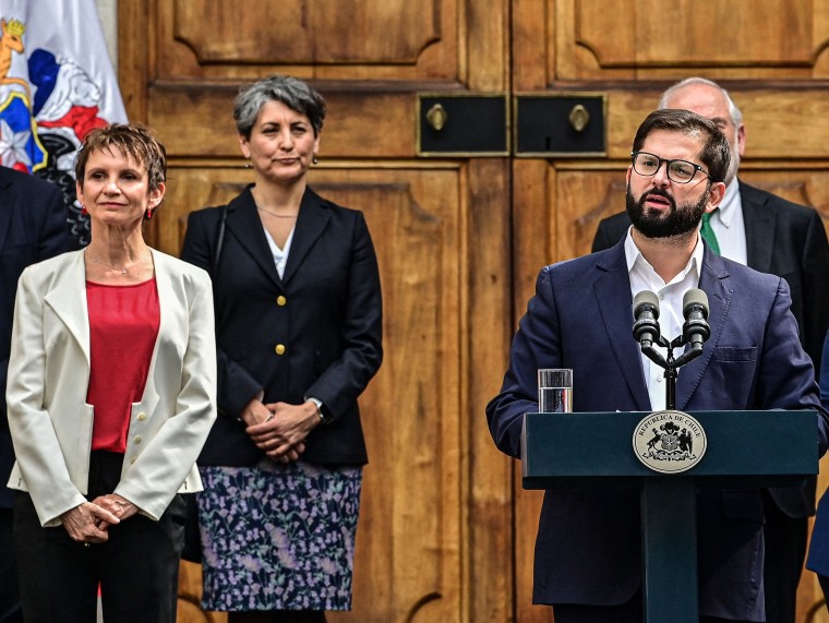 Image: Chilean President Gabriel Boric, right, speaks next to the new Minister of the Interior and Public Security, Carolina Toha, left, during a ceremony at La Moneda presidential palace in Santiago, on Sept. 6, 2022