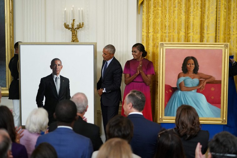 Image: Former president Barack Obama and wife Michelle Obama stand by their official White House portraits after they were unveiled in the East Room of the White House on Sept. 7, 2022.