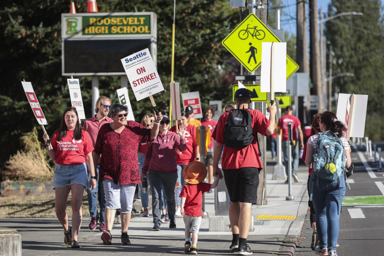Image: Teachers from Seattle Public Schools picket outside Roosevelt High School on what was supposed to be the first day of classes on Sept. 7, 2022, in Seattle.