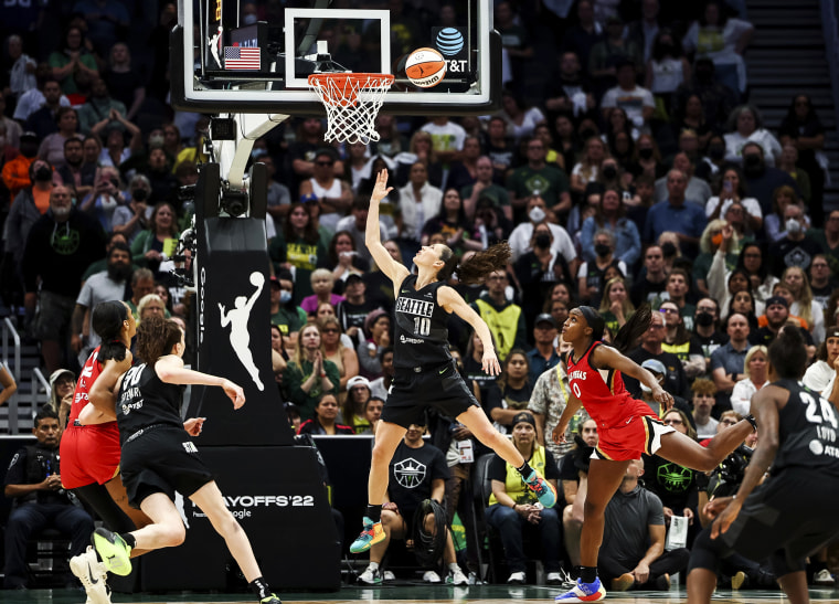 Seattle Storm guard Sue Bird scores past Las Vegas Aces guard Jackie Young on Sept. 6, 2022, in Seattle.