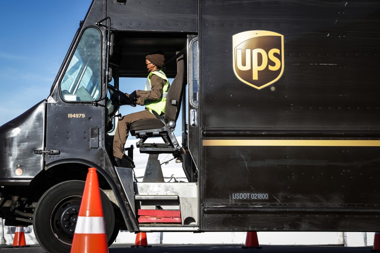 A United Parcel Service (UPS) driver leaves a UPS facility on March 15, 2021 in Landover, Md.