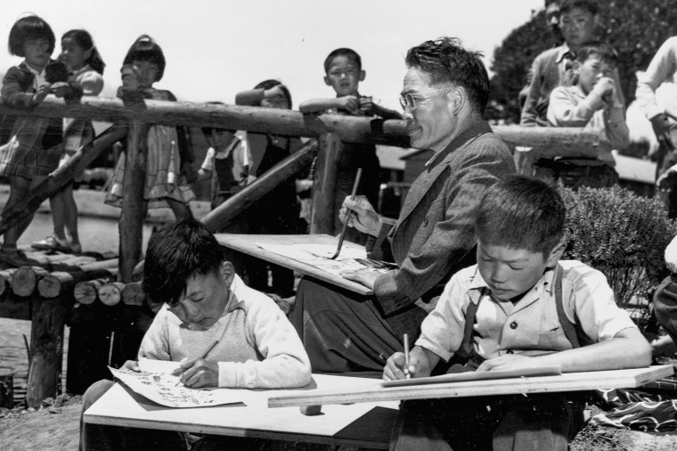 Japanese Americans participate in art class given by Chiura Obata, a noted Japanese artist, at the Tanforan Assembly Center internment camp in San Bruno, Calif., in 1942.