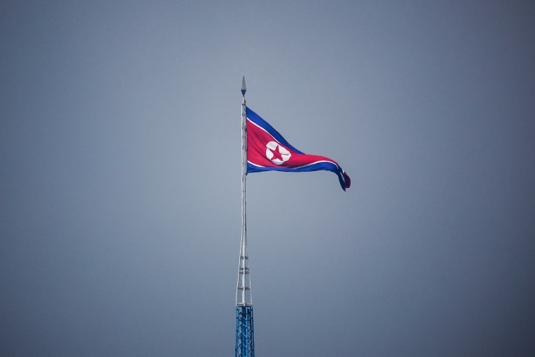 A North Korean flag flies over Gijungdong in North Korea on July 19, 2022.