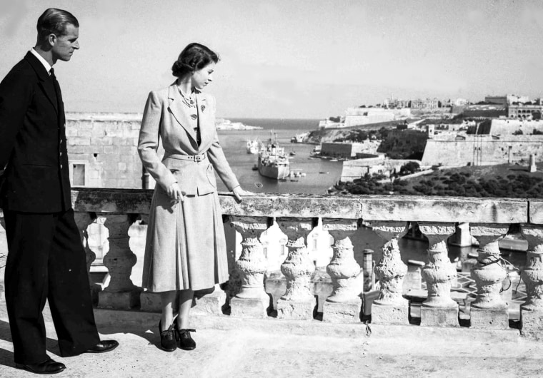 Princess Elizabeth and her husband Prince Philip, the Duke of Edinburgh, look out over the harbor and city of Valetta, Malta, on Nov. 23, 1949.