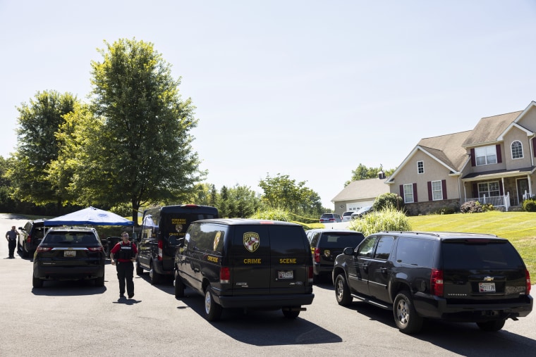 Law enforcement gather at the scene of a shooting