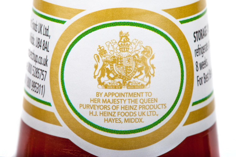 LONDON, UK - MAY 6, 2016: A close up of the Royal Warrant of Appointment on a jar of Heinz ketchup isolated on a plain