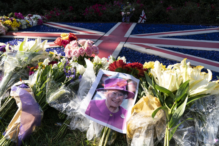 Flowers and a photograph of Queen Elizabeth II are laid outside the British Embassy in Washington on Sept. 9, 2022.