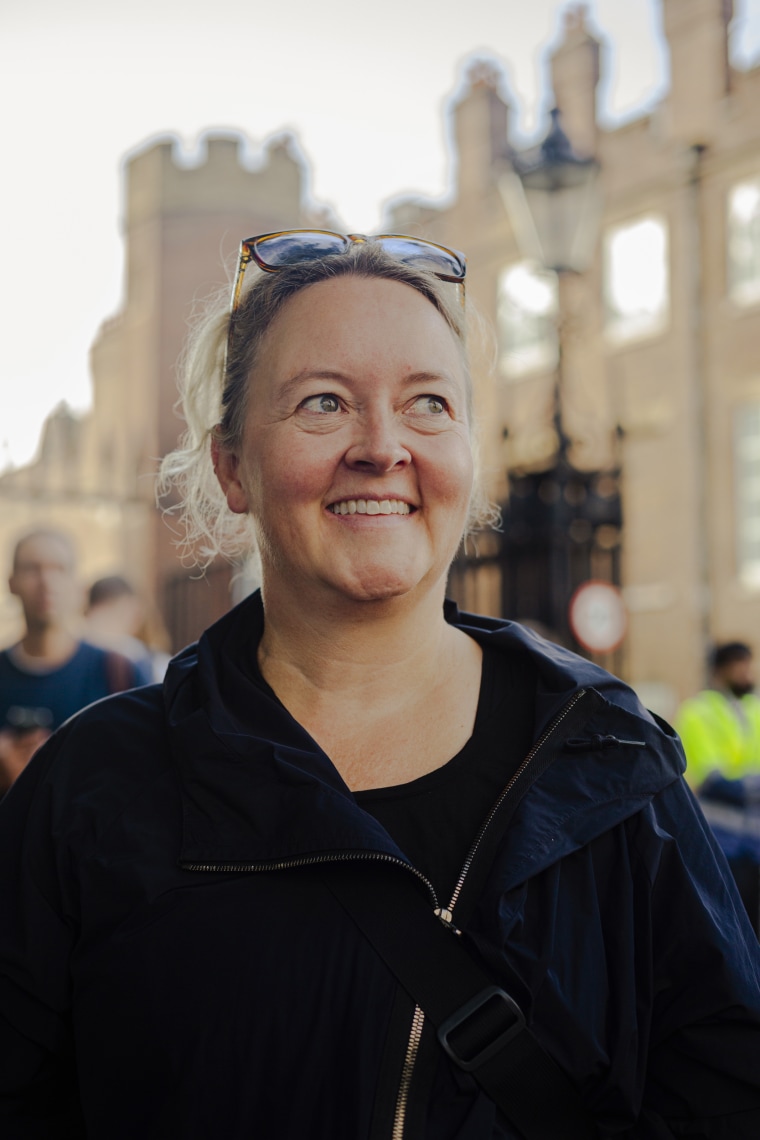 Penny McDermid waits outside St. James' Palace