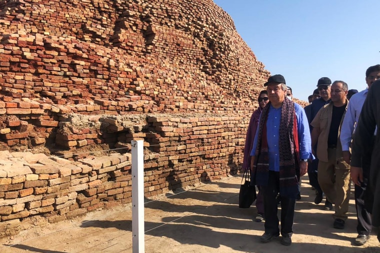 United Nations Secretary-General Antonio Guterres, second from left, walks through the UNESCO World Heritage archeological site of Mohenjo Daro damaged by flood waters in Sindh province province on September 10, 2022.