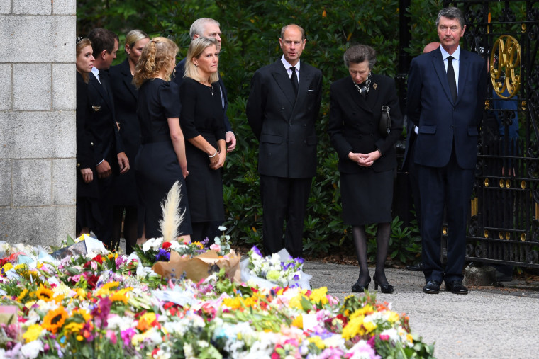The Royal Family views flowers laid outside Balmoral Castle