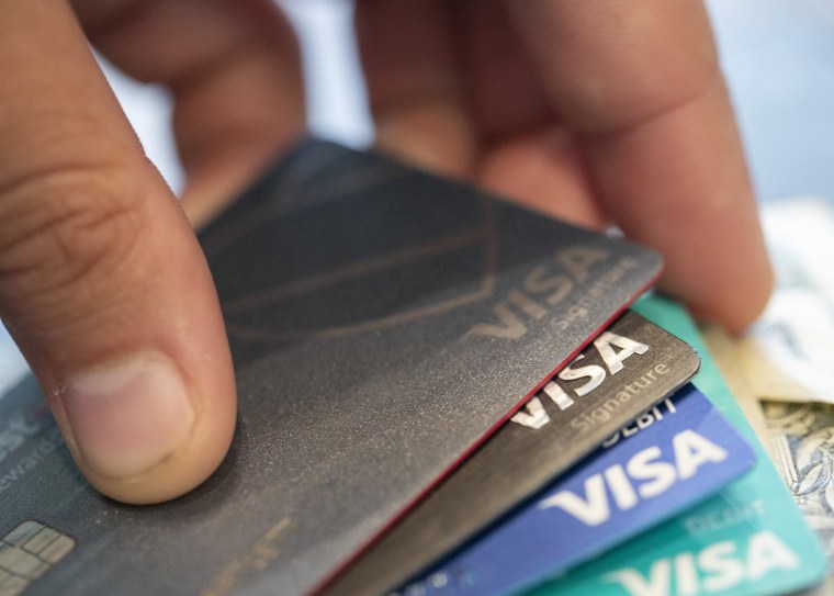 A stack of Visa credit cards.