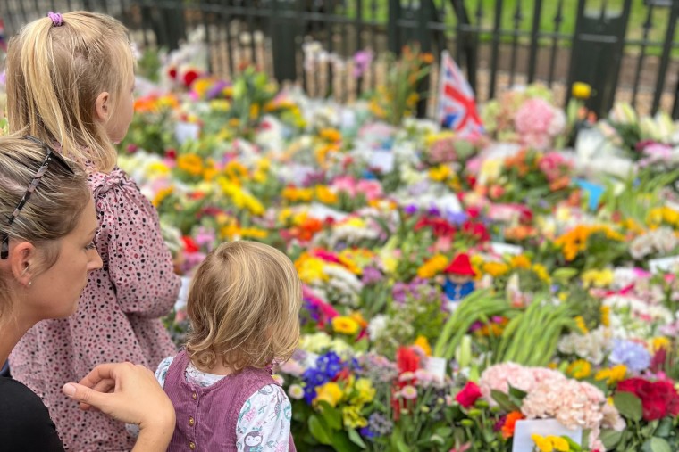 A mother and her children pay their respects at Windsor.