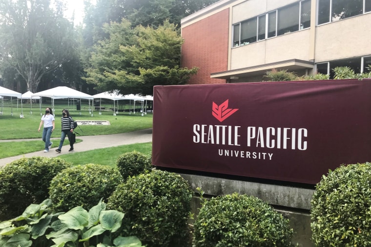 Students walk on the campus of Seattle Pacific University in Seattle on Sept. 11, 2022.