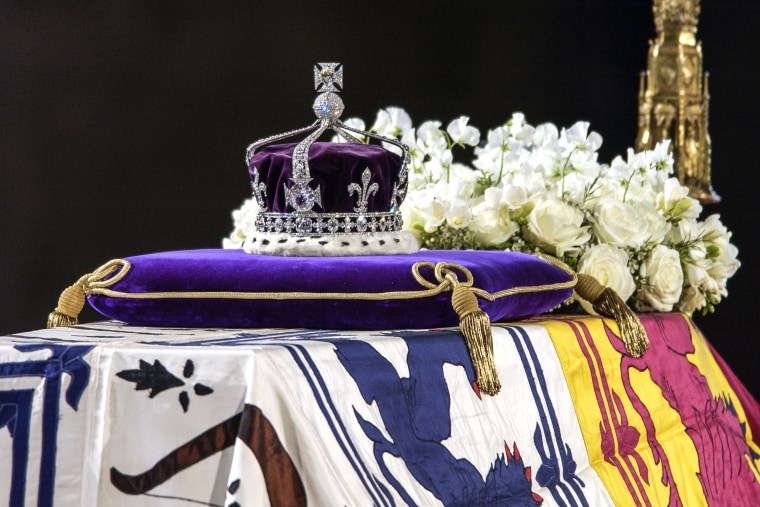 The Queen Mother's coffin, the wreath of white flowers and the Queen Mother's coronation crown with the priceless Koh-I-Noor diamond on April 8, 2002.