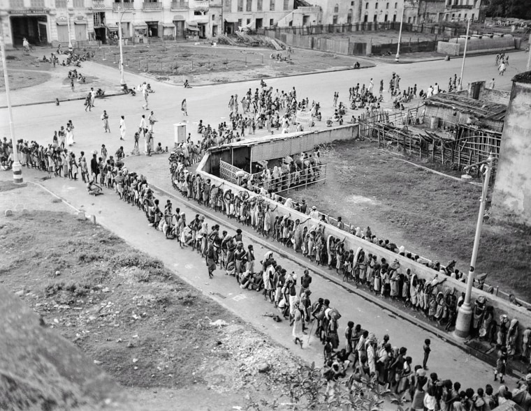 Indian citizens wait in line at a soup kitchen in Calcutta, October 1943 at the peak of the famine.