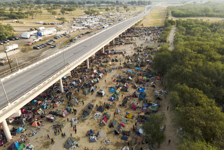 Image: Migrants, many from Haiti, at an encampment along the Del Rio International Bridge near the Rio Grande, in Del Rio, Texas, on Sept. 21, 2021.