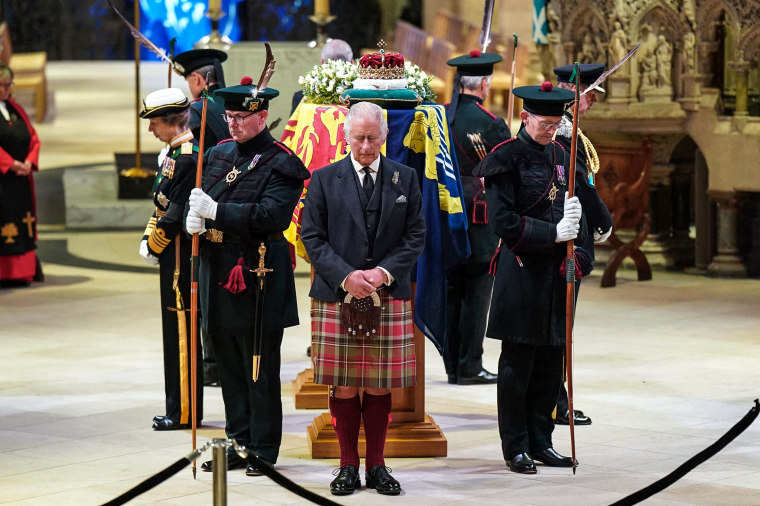 Image: King Charles III and other members of the royal family hold a vigil at the coffin of Queen Elizabeth II at St Giles' Cathedral, Edinburgh, Scotland on Sept. 12, 2022.
