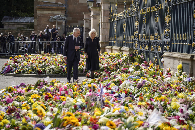 Image: King Charles III and the Queen Consort view floral tributes outside Hillsborough Castle, Belfast, onSept. 13, 2022.