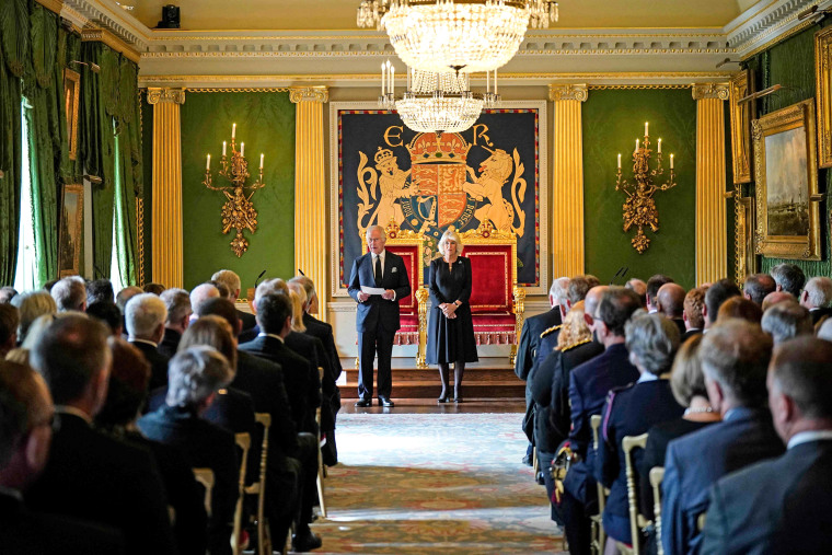 Image: King Charles III, flanked by Camilla, Queen Consort, makes a speech after receiving a message of condolence following the death of his mother Queen Elizabeth II, at Hillsborough Castle in Belfast on Sept. 13, 2022, during his visit to Northern Ireland.