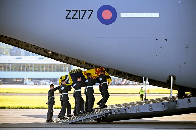 Image: Pallbearers from the Queen's Colour Squadron of the Royal Air Force (RAF) carry the coffin of Queen Elizabeth II, draped in the Royal Standard of Scotland, into a RAF C17 aircraft at Edinburgh airport on Sept. 13, 2022, before it is transported to Buckingham Palace in London.