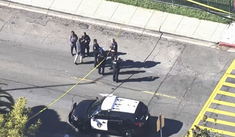 Police work at the scene of a shooting at Vallejo High School
