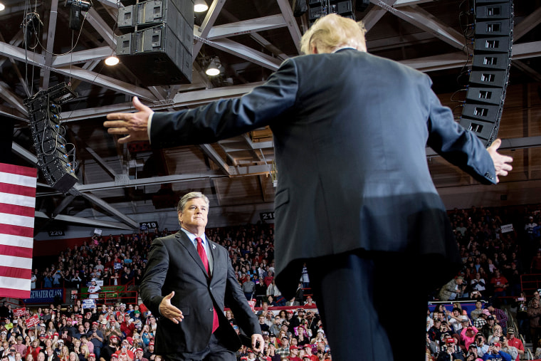 Donald Trump greets talk show host Sean Hannity at a Make America Great Again rally in Cape Girardeau, Miss. on November 5, 2018.
