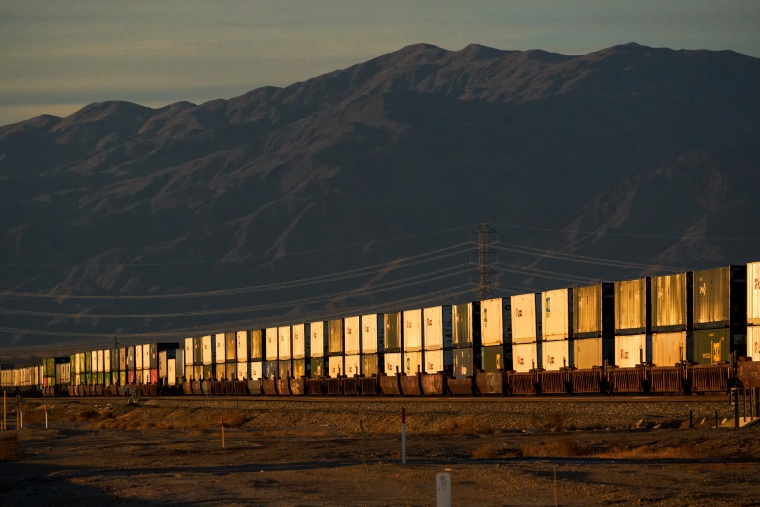 Cargo containers onboard a freight train in Niland, Calif., on Dec. 15, 2021.