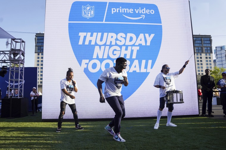 Robert "Bojo" Ackah, center, and Fik-Shun, left, perform during the announcement of the first Thursday Night Football on Prime Video matchup featuring the San Diego Chargers and Kansas City Chiefs on April 28, 2022, in Las Vegas.