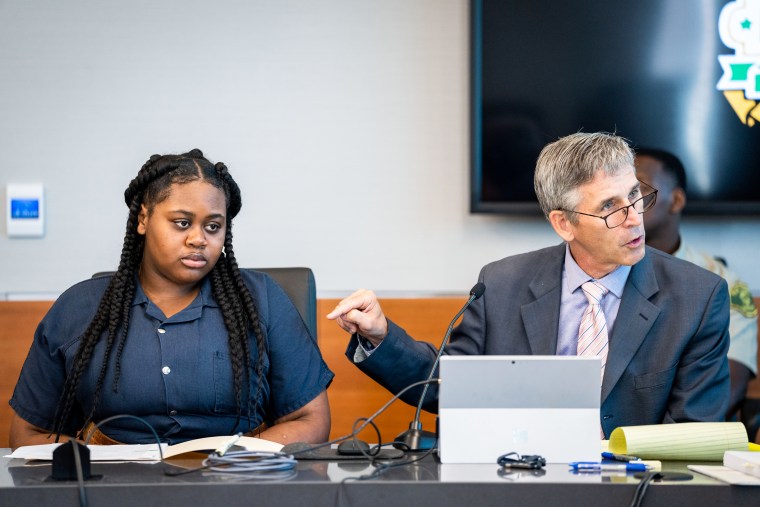 Pieper Lewis listens as her attorney Matthew Sheeley questions a witness during a sentencing hearing on Sept. 13, 2022.