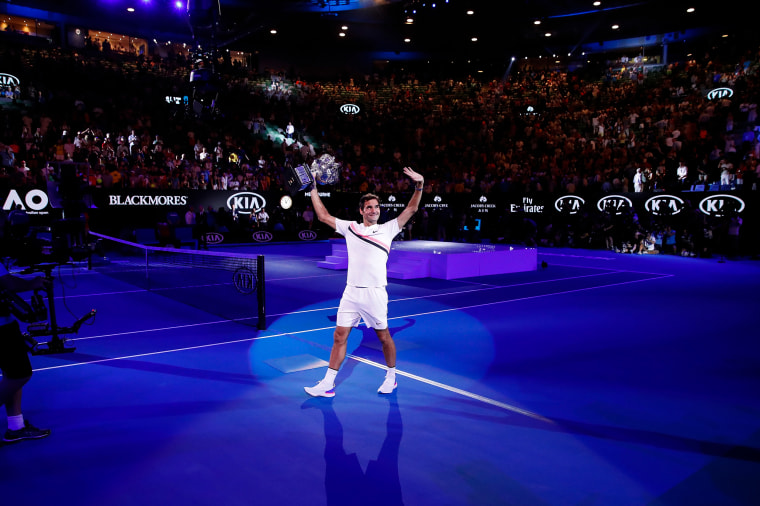 Roger Federer waves to the crowd after winning the Australian Open on Jan. 28, 2018, in Melbourne.