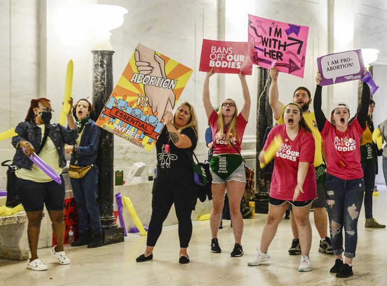 Abortion rights supporters demonstrate outside the Senate chamber at the West Virginia state Capitol