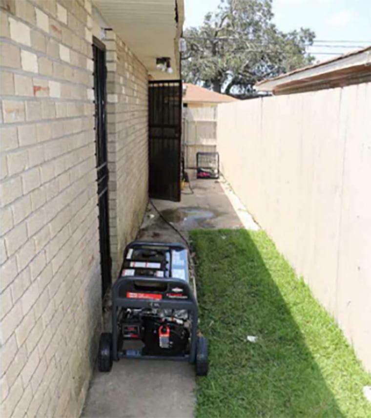 Image: Curley family's side yard with the portable generator.