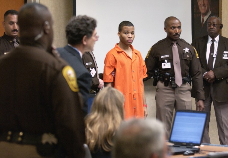 Lee Boyd Malvo, center, is brought into court during the murder trial in 2003.