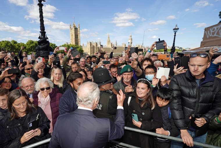 King Charles III meets members of the public in the queue along the South Bank, near to Lambeth Bridge, London, as they wait to view Queen Elizabeth II lying in state ahead of her funeral on Monday, on Sept. 17, 2022.