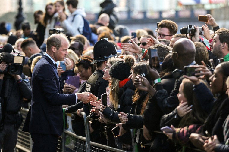 Image: Prince William, Prince of Wales talks with members of the public waiting in the queue to pay their respects to Queen Elizabeth II, lying in state at the Palace of Westminster, in London on Sept. 17, 2022.