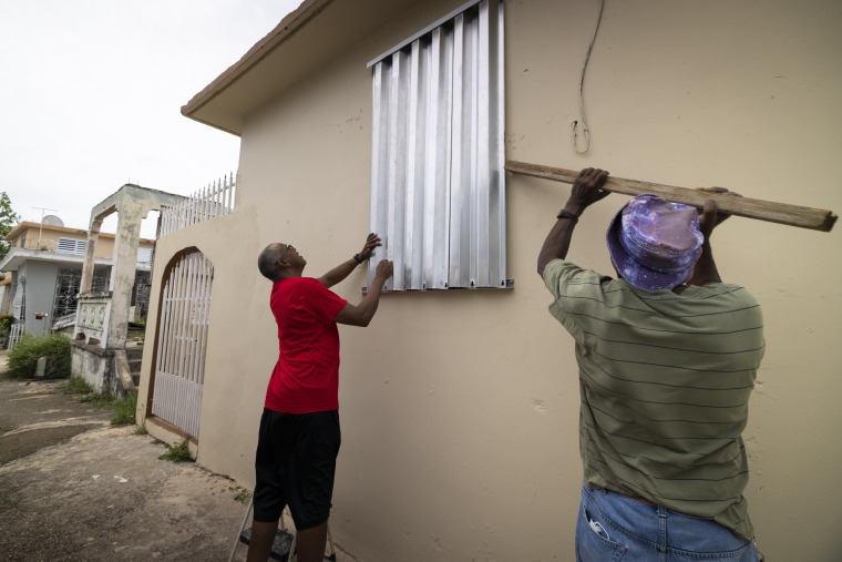 Residents prepare for the arrival of Tropical Storm Fiona, in Loiza, Puerto Rico, Saturday, Sept. 17, 2022.