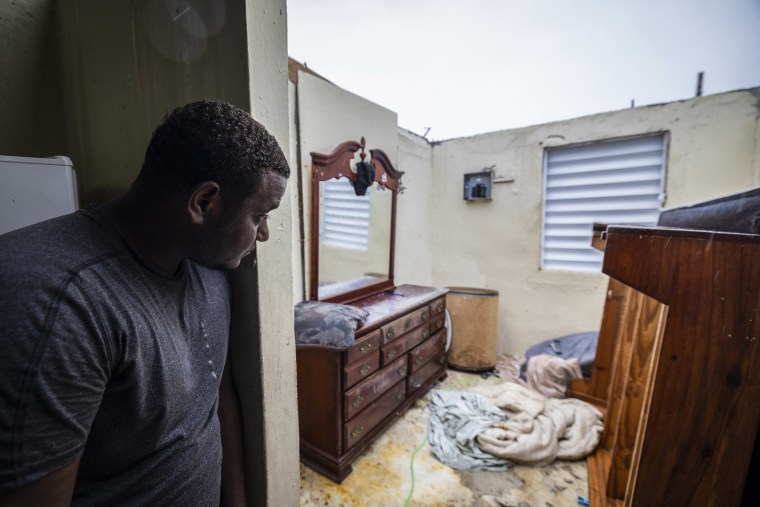 Nelson Cirino sees his bedroom after the winds of hurricane Fiona tore the roof off his house in Loiza, Puerto Rico, on Sept. 18, 2022.